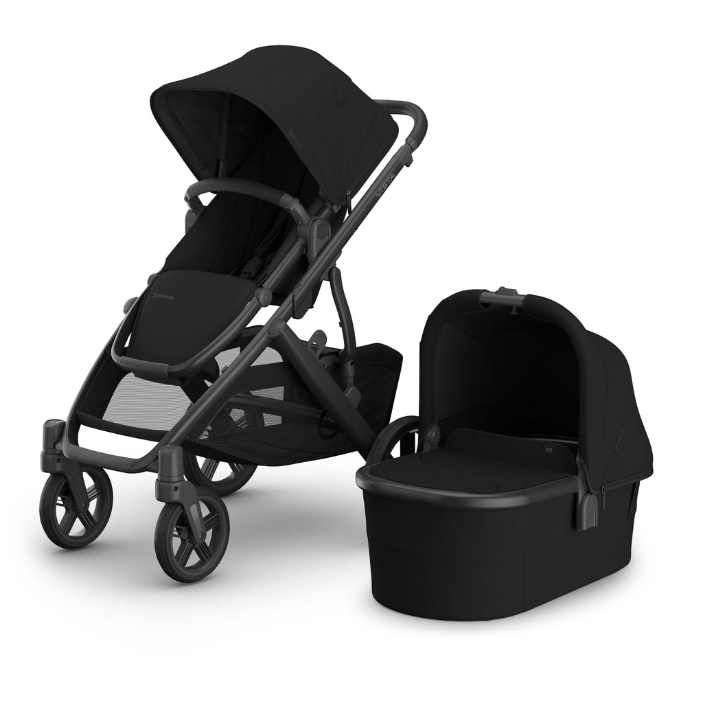Black Uppababy Vista V3 stroller with matching bassinet on a white background