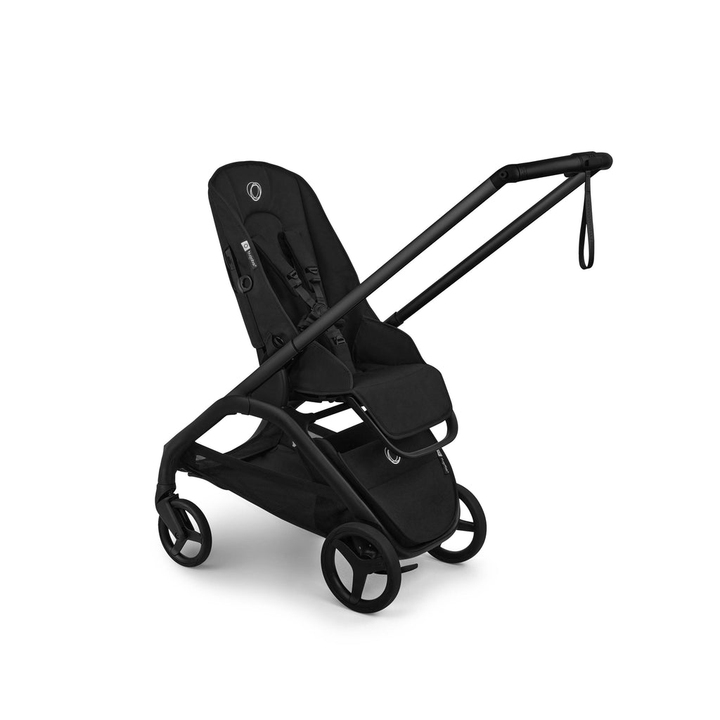 Three quarter shot of a black Bugaboo Dragonfly Plus stroller in parent facing mode on a white background - no canopy