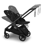Black stroller with transparent multiple recline positions on a white background