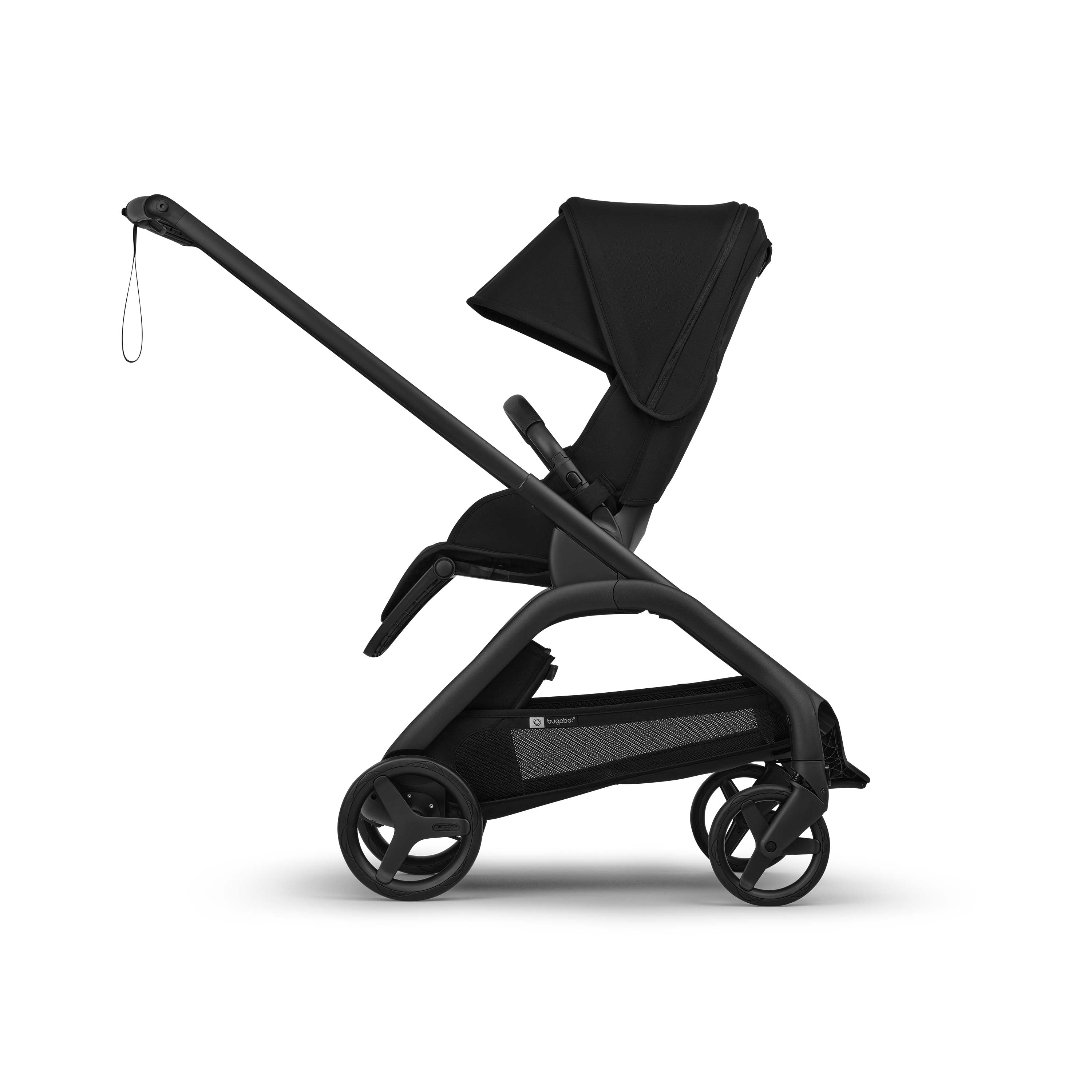 Side shot of a black Bugaboo Dragonfly Plus stroller in parent facing mode on a white background