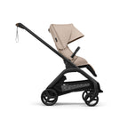Bugaboo Dragonfly Plus Stroller side shot world facing in Desert Taupe and black chassis on a white background