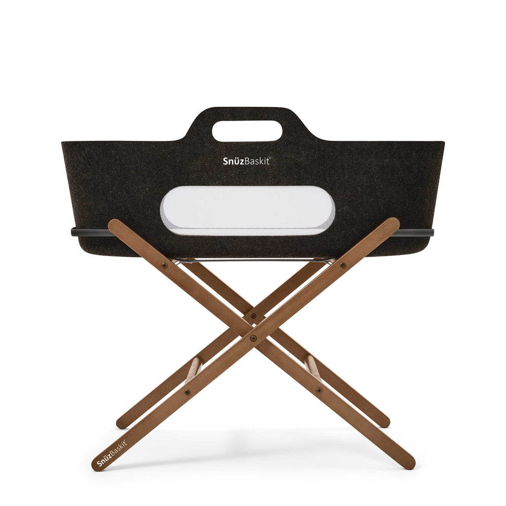 Graphite SnuzBaskit with white branding and walnut stand displayed on a white background