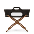 Graphite SnuzBaskit with white branding and walnut stand displayed on a white background