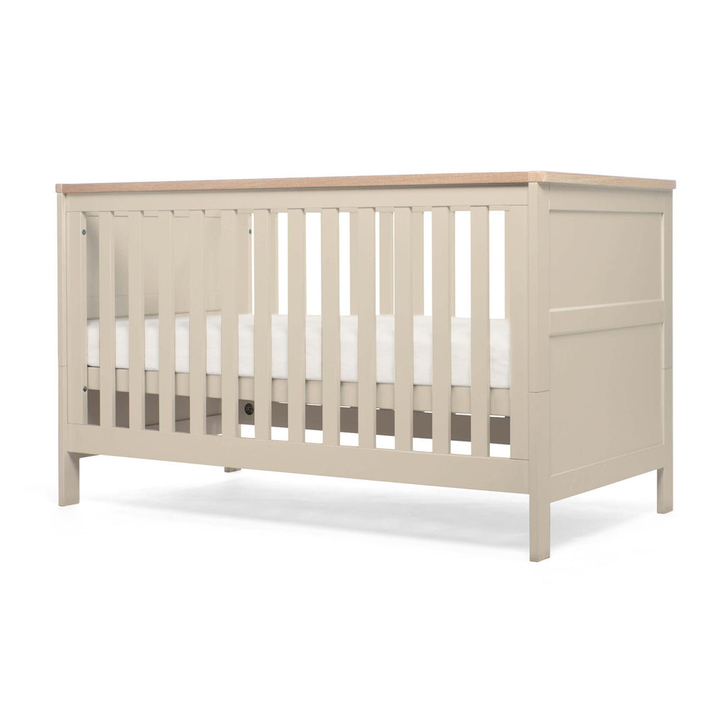 Pebble Grey crib with wooden top on a white background