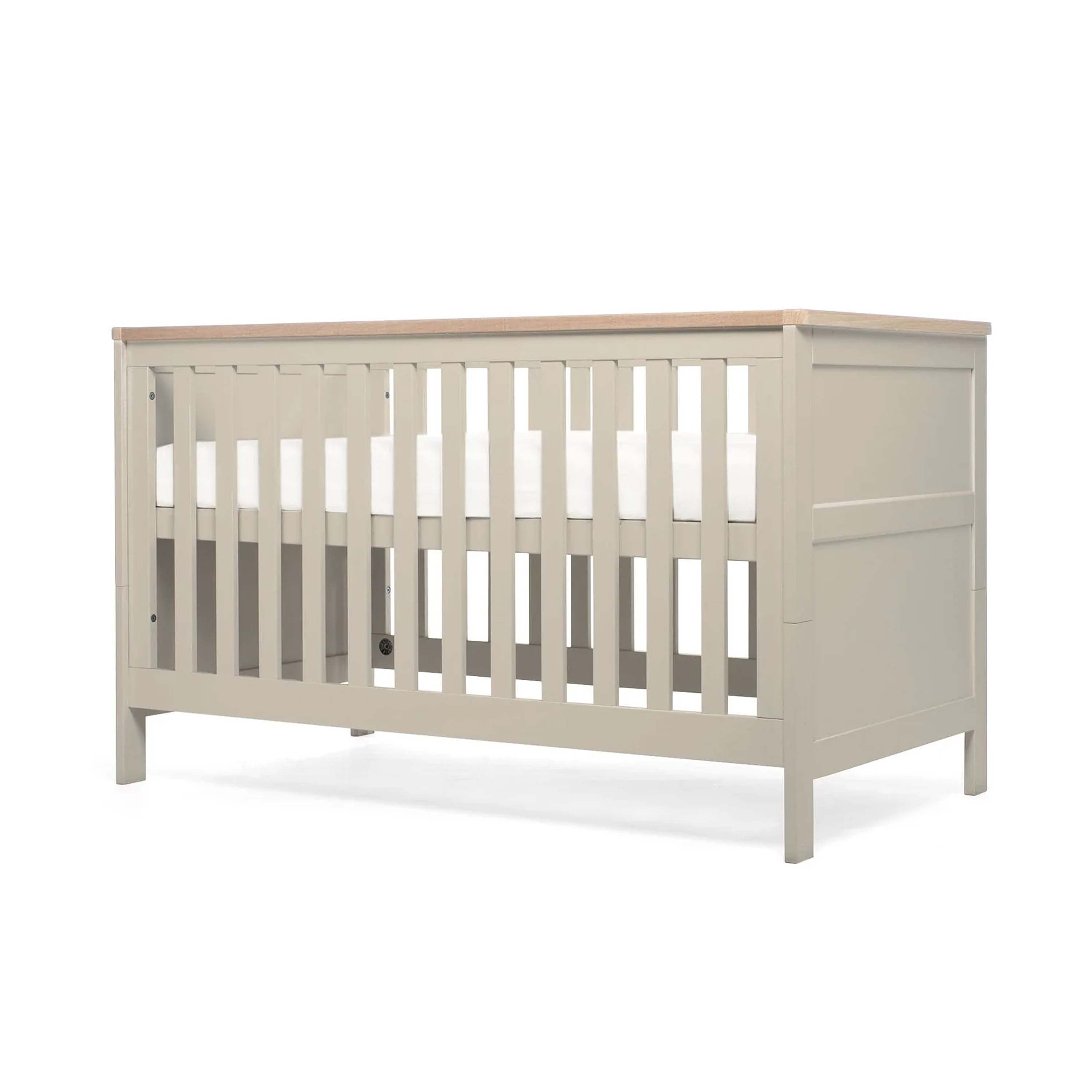 Pebble Grey crib with wooden top and base in highest position on a white background