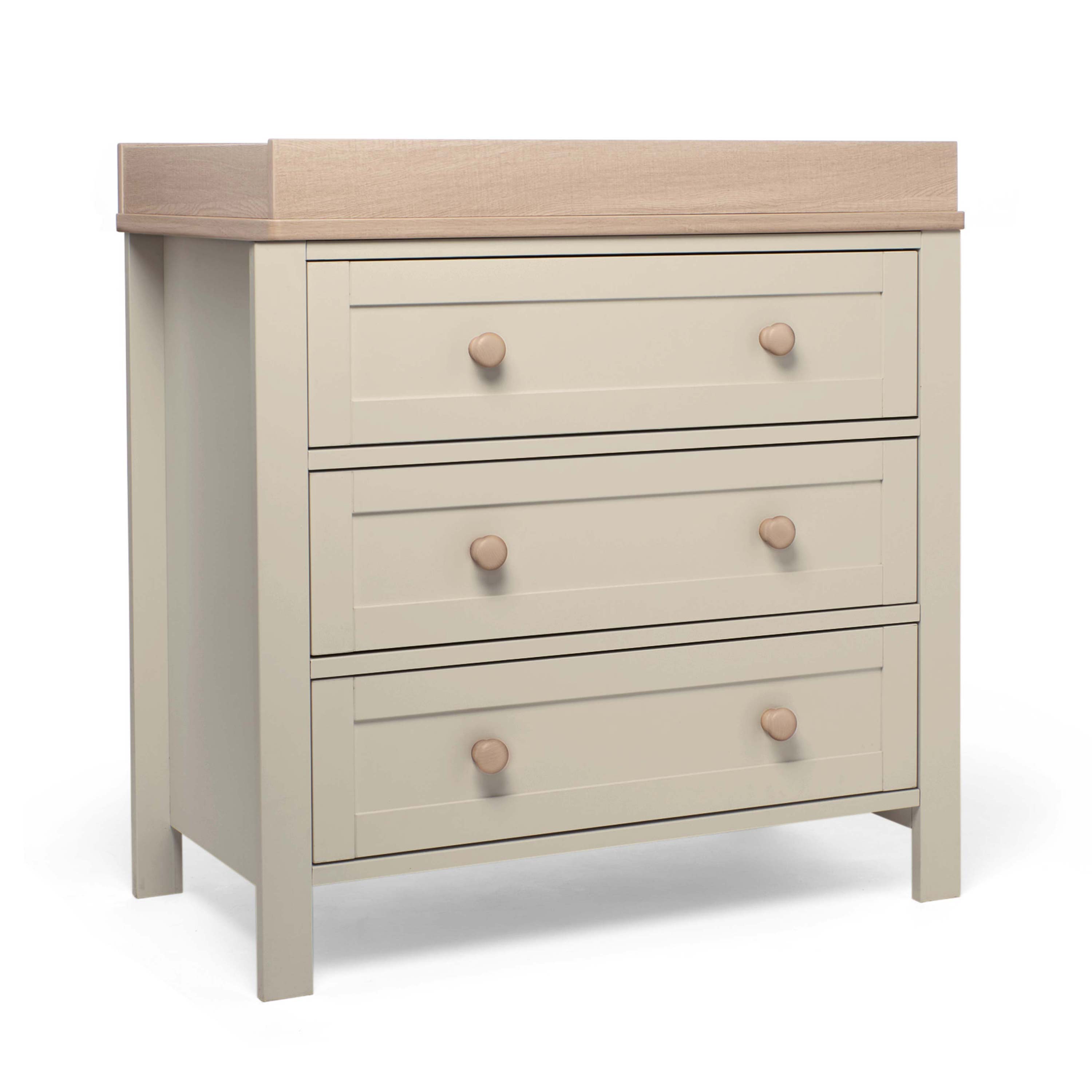 Pebble grey dresser with wood coloured changer top and three drawers on a white background