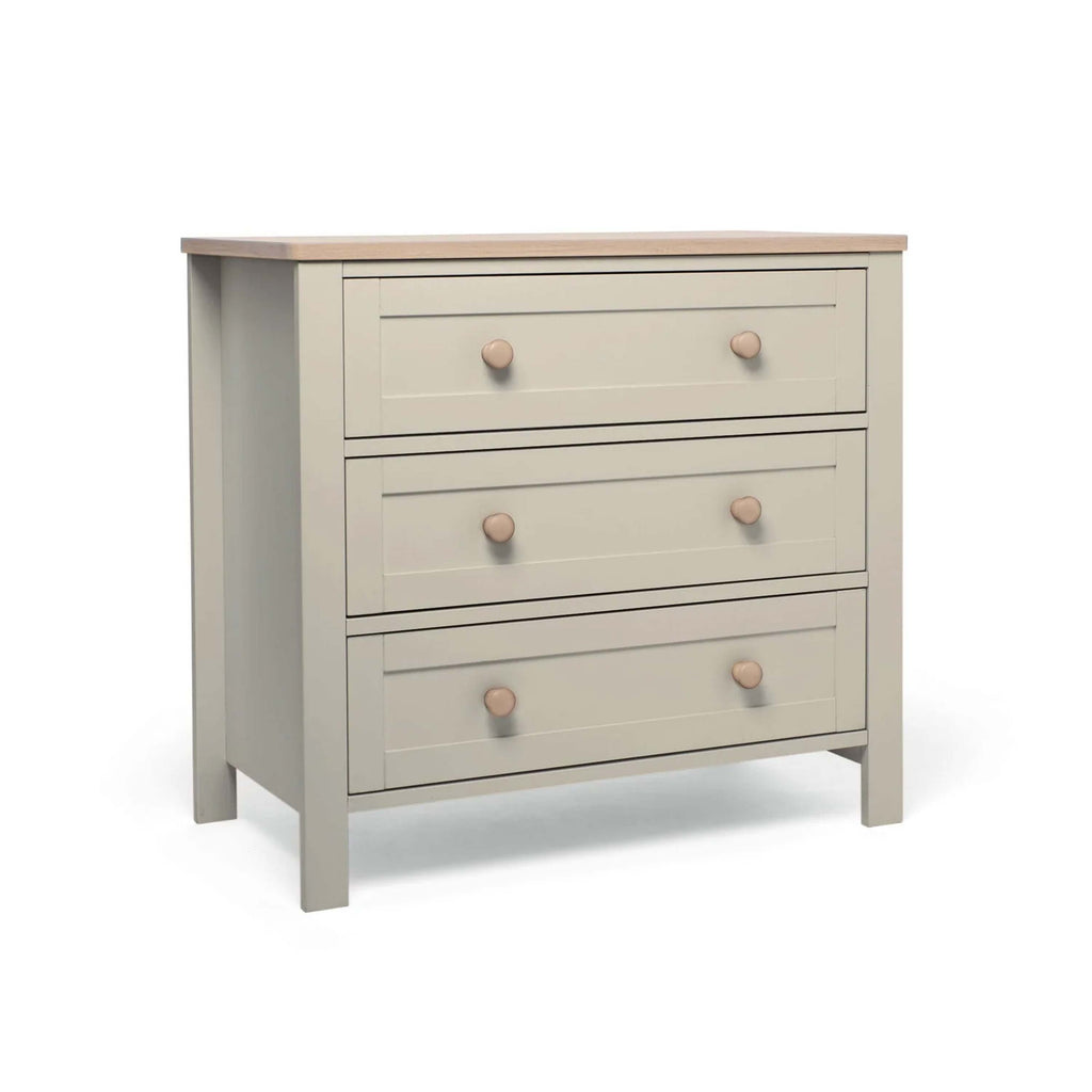 Beige dresser with three large drawers and top changer removed on a white background