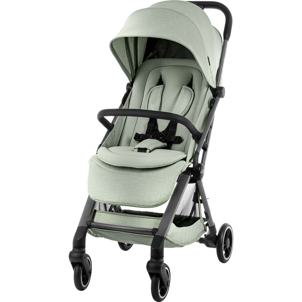 A compact stroller in a light sage green fabric with a grey frame and wheels, shown from a three-quarter angle on a solid white background.