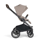 Stroller side view with beige canopy on a white background