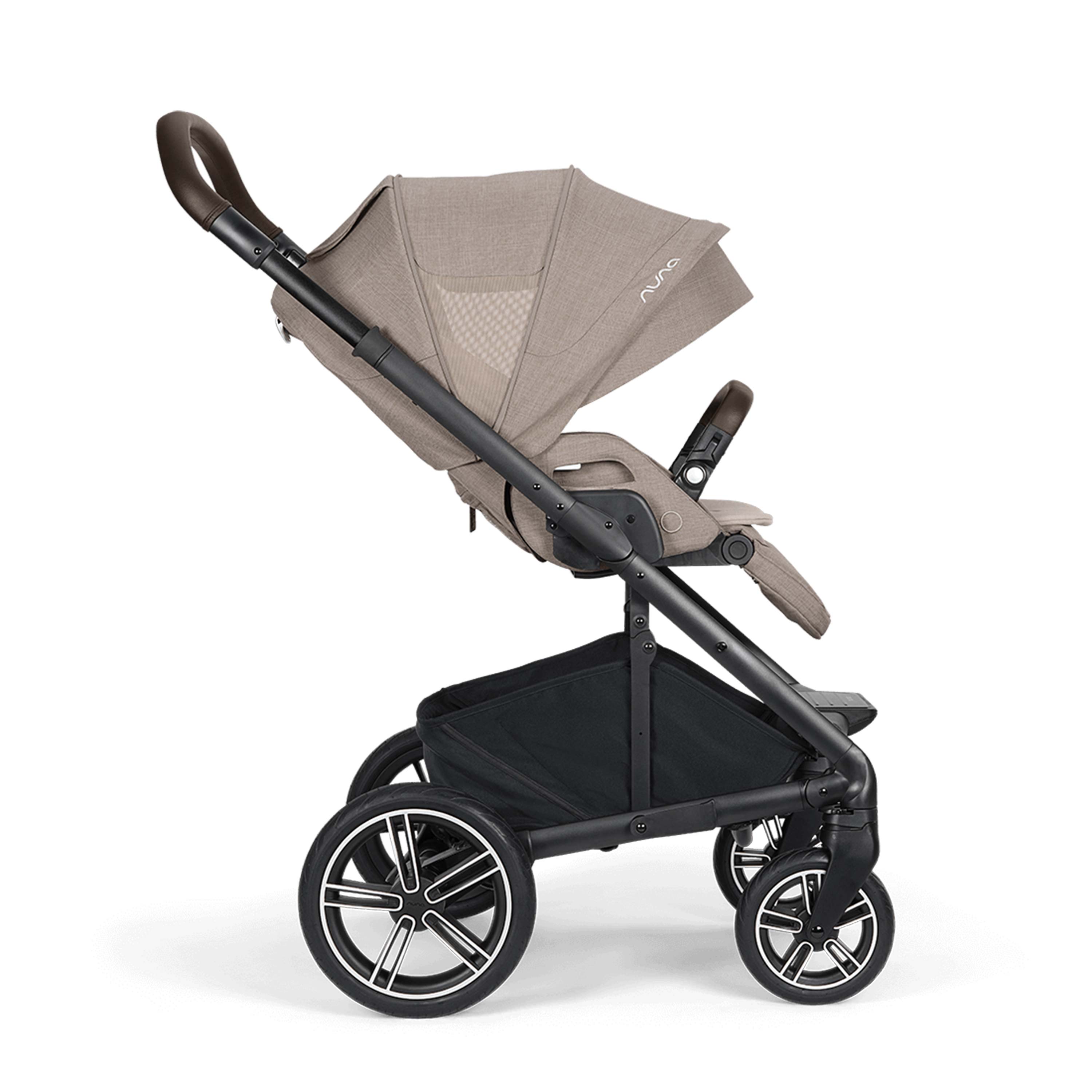 Stroller with extended beige canopy and black frame on a white background