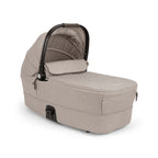 Beige baby stroller bassinet on a white background