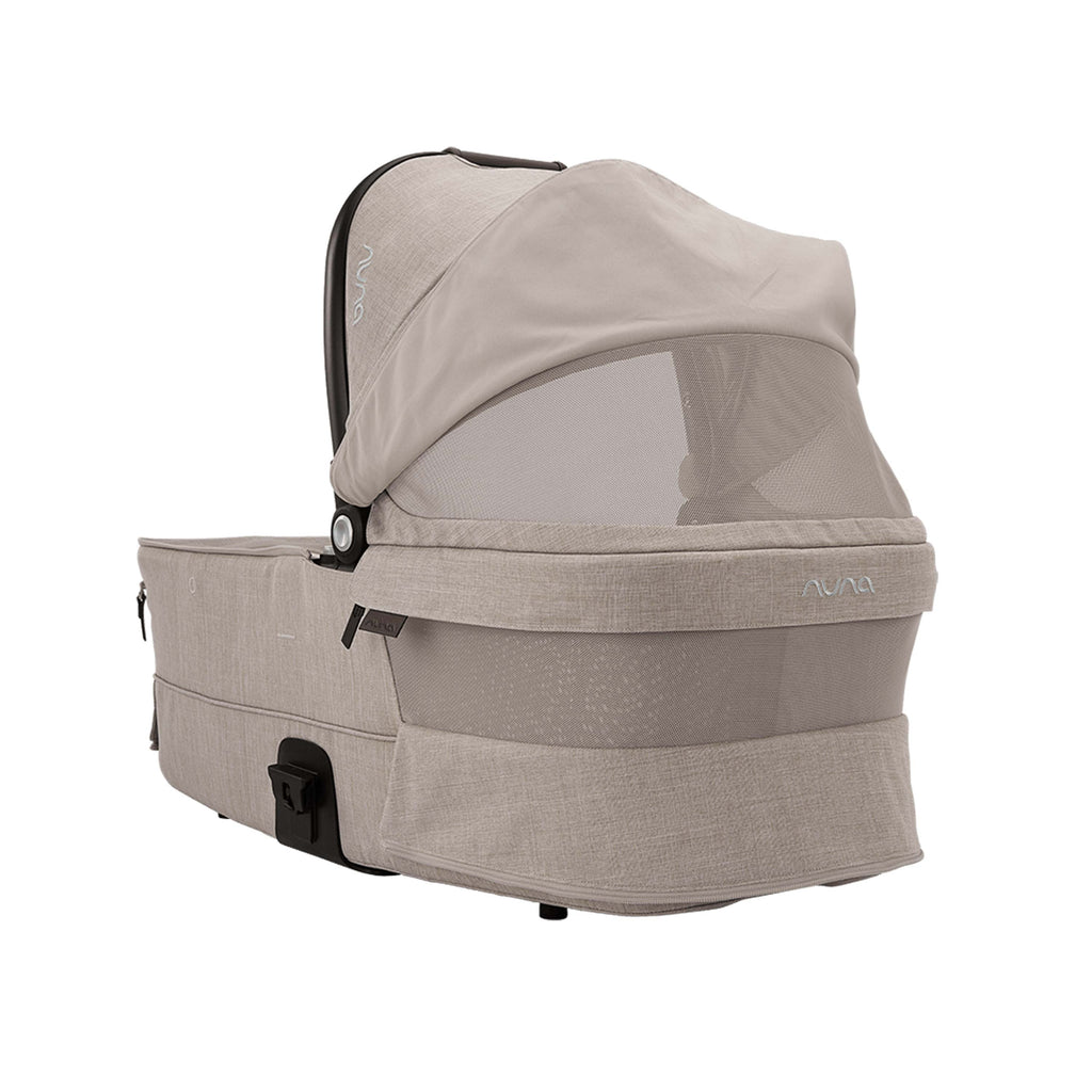 Beige baby bassinet with mesh window on a white background