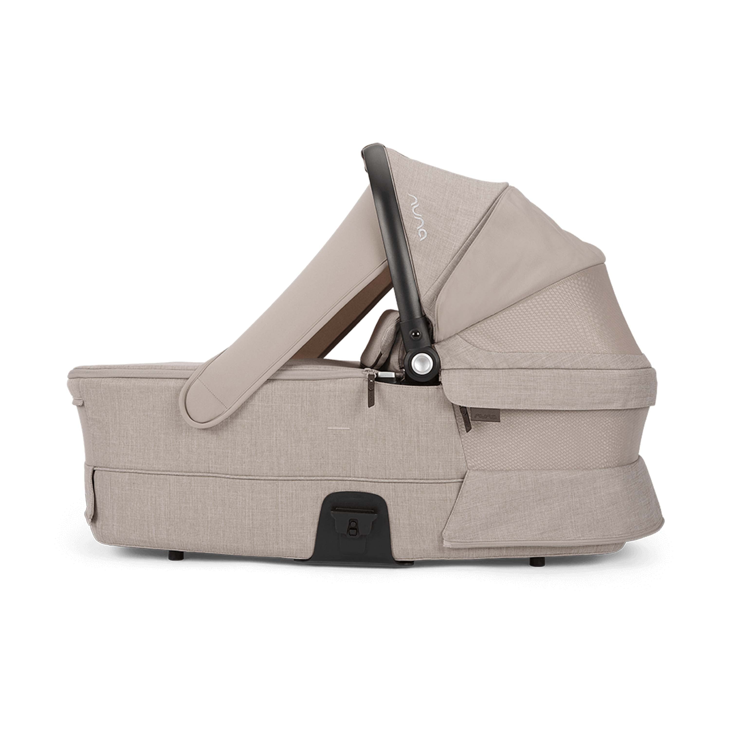 Beige baby carrier side view with sunshade on a white background